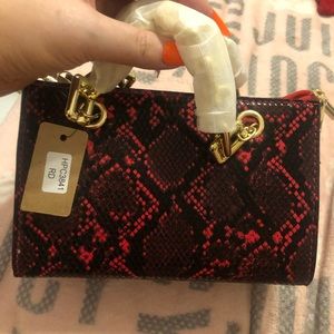 Red and black snakeskin bag